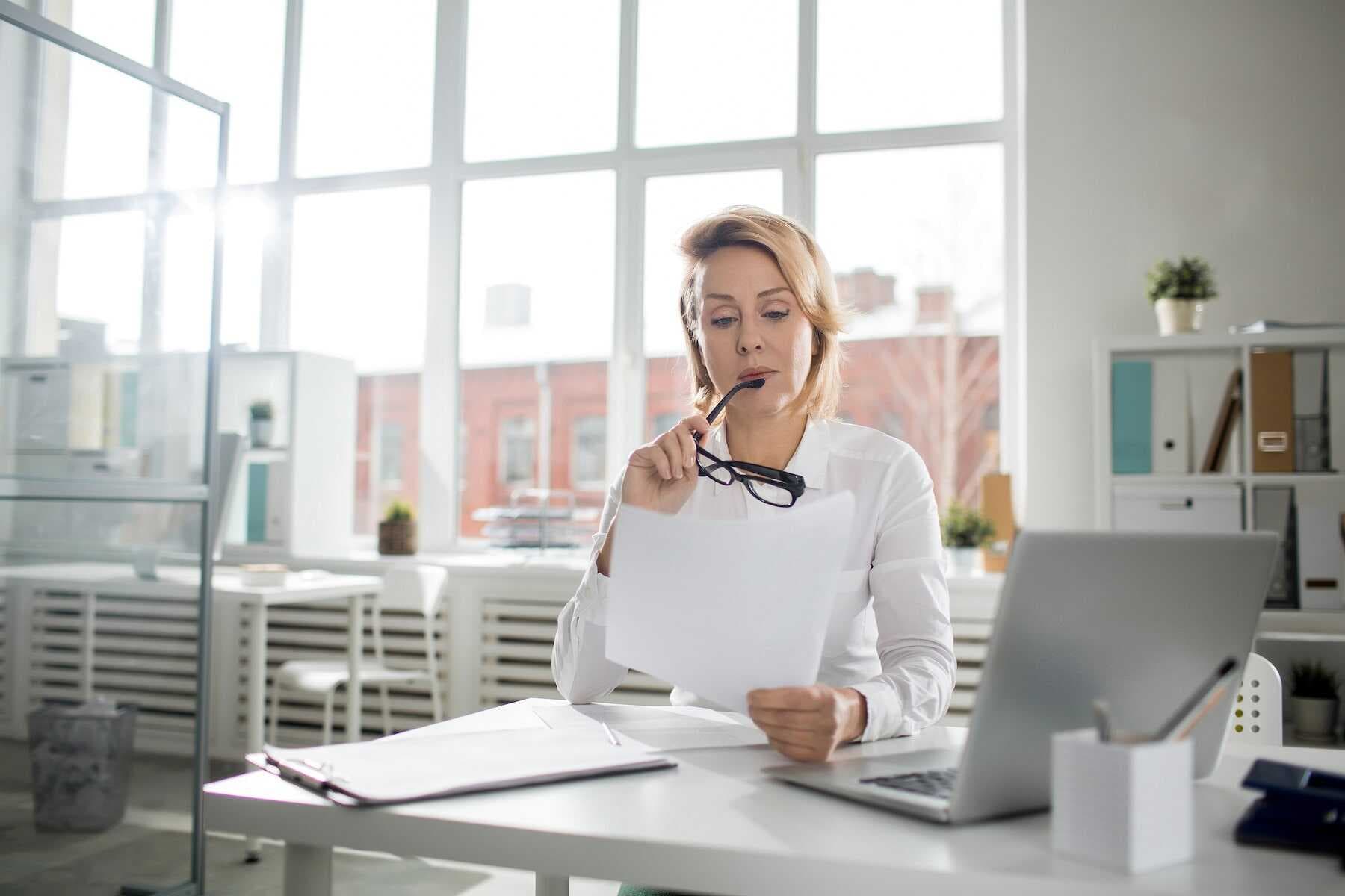 women reading paper